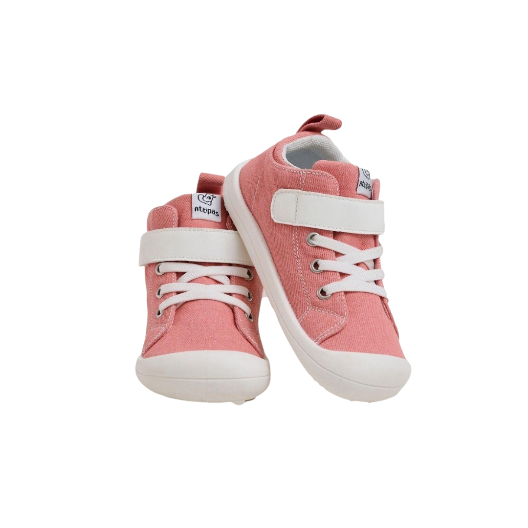 Sapatilhas cor-de-rosa para criança com atacadores brancos e tira de velcro