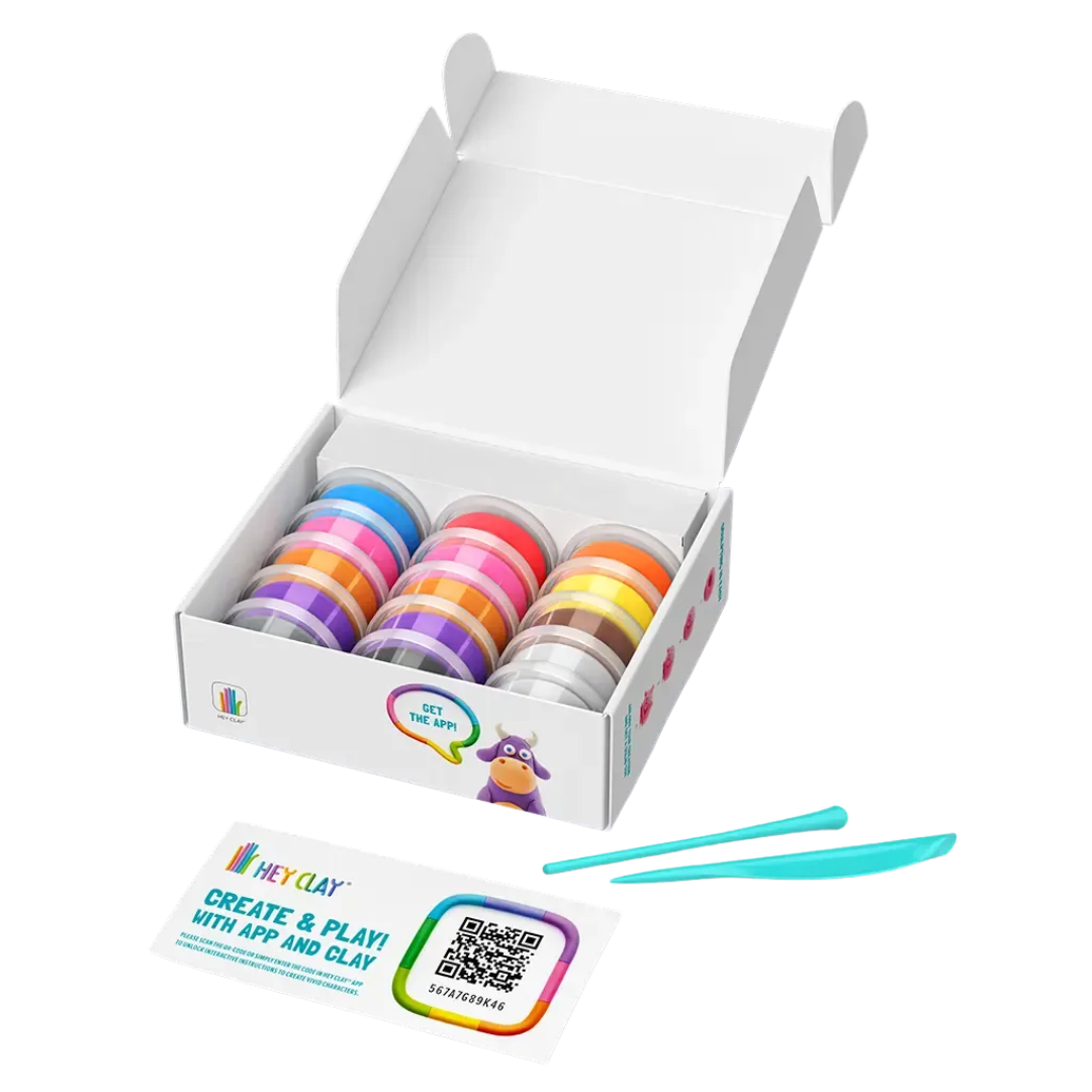 Caixa branca com latas coloridas de massa modelar, ferramentas azuis e cartão com QR code