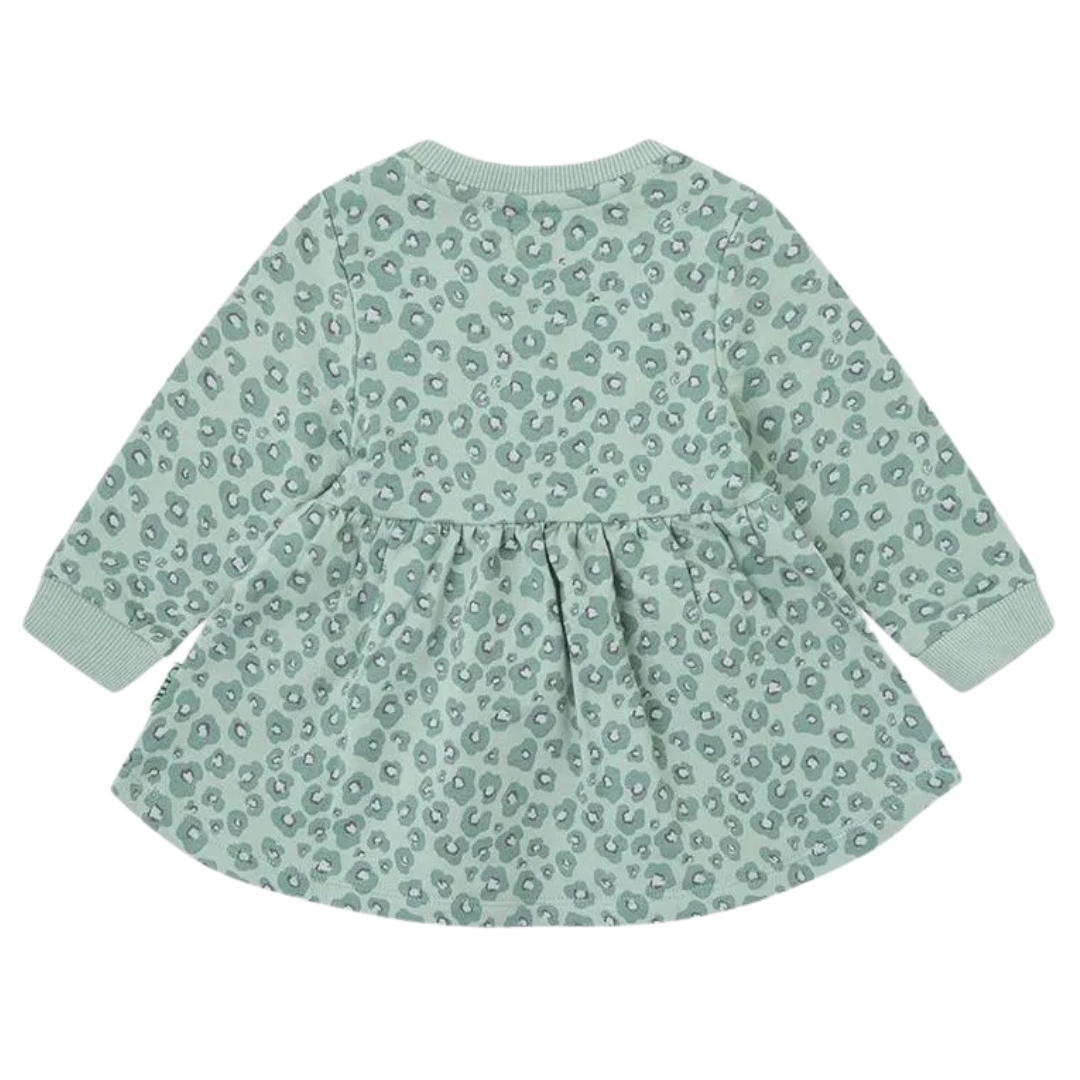 Vestido infantil verde com padrão de manchas e mangas compridas