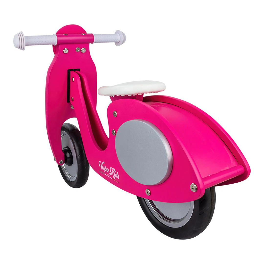 Triciclo infantil rosa com assento branco e rodas pretas