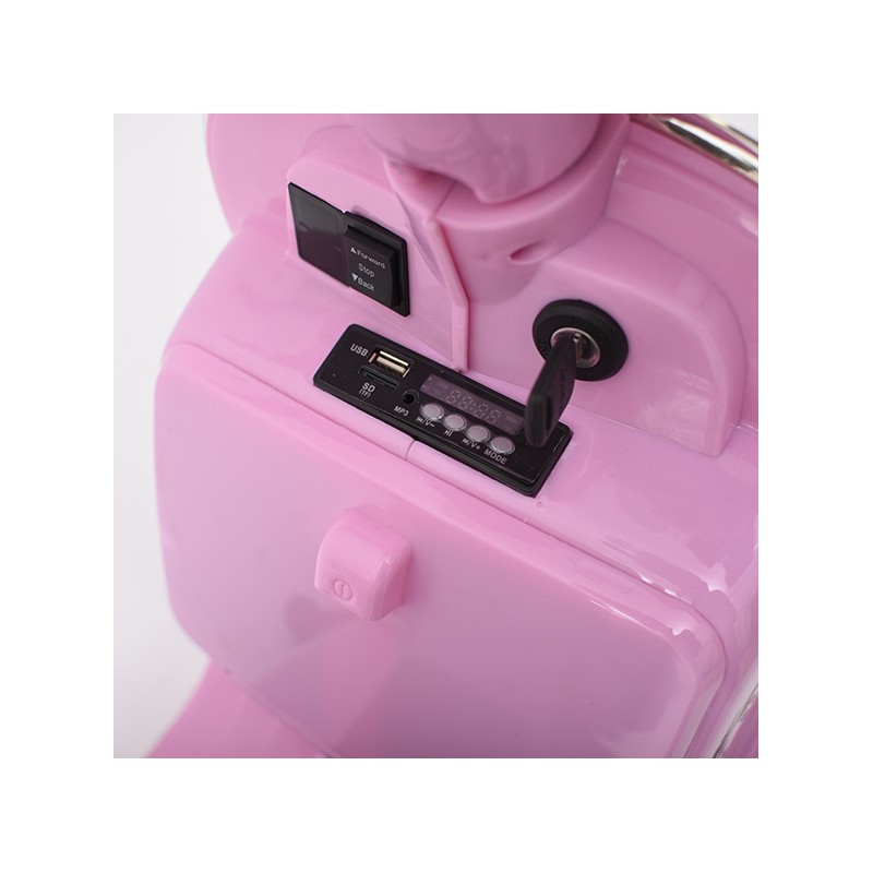 Detalhe rosa de dispositivo com interruptor, porta USB, botões e chave inserida