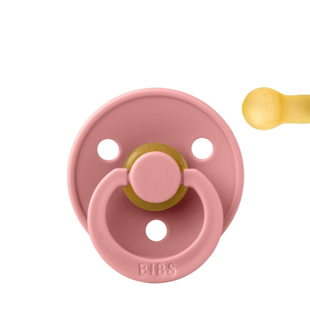 Chupeta BIBS rosa com anel e chupeta amarela ao lado