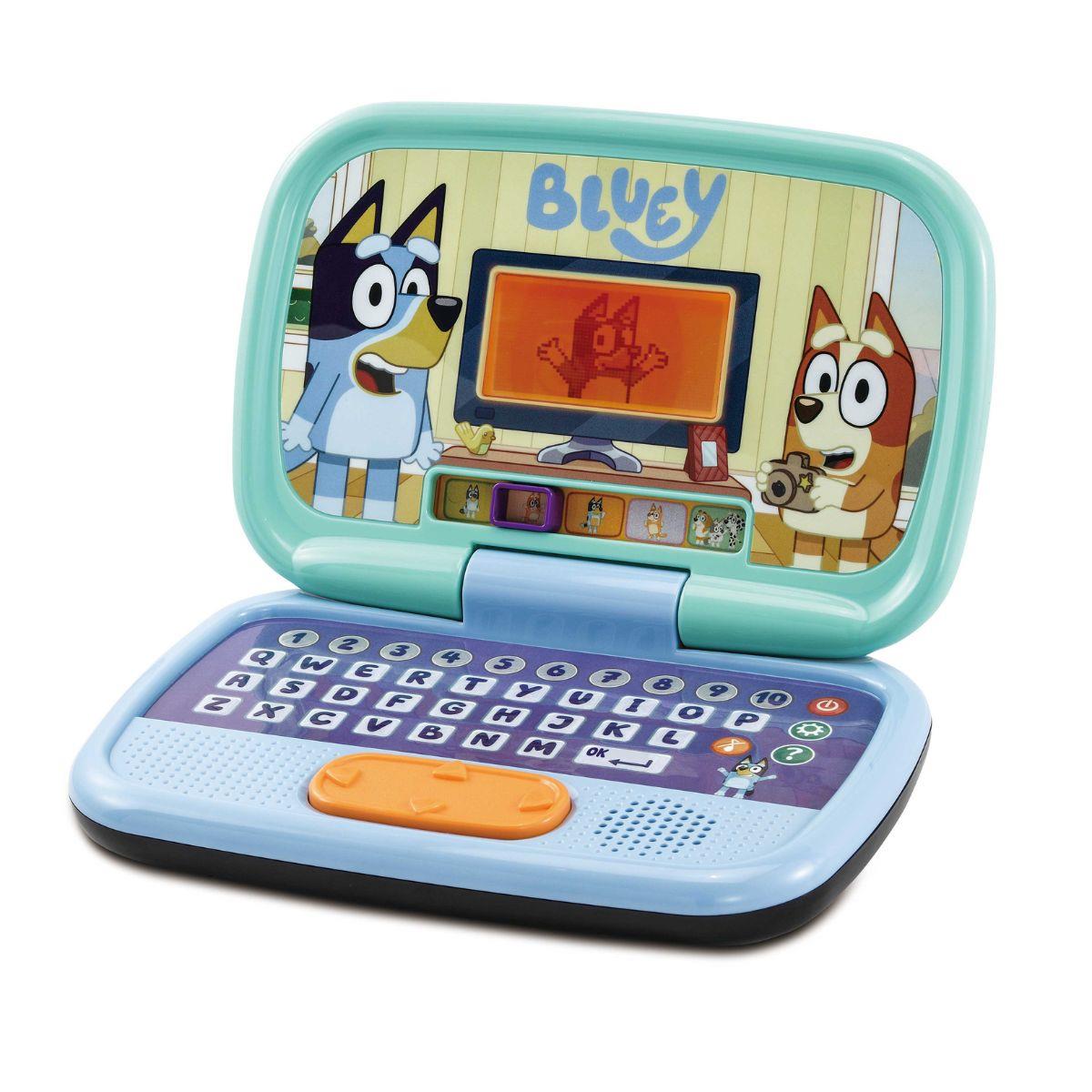 Computador brinquedo infantil com teclado e ecrã azul claro e roxo com personagens animadas