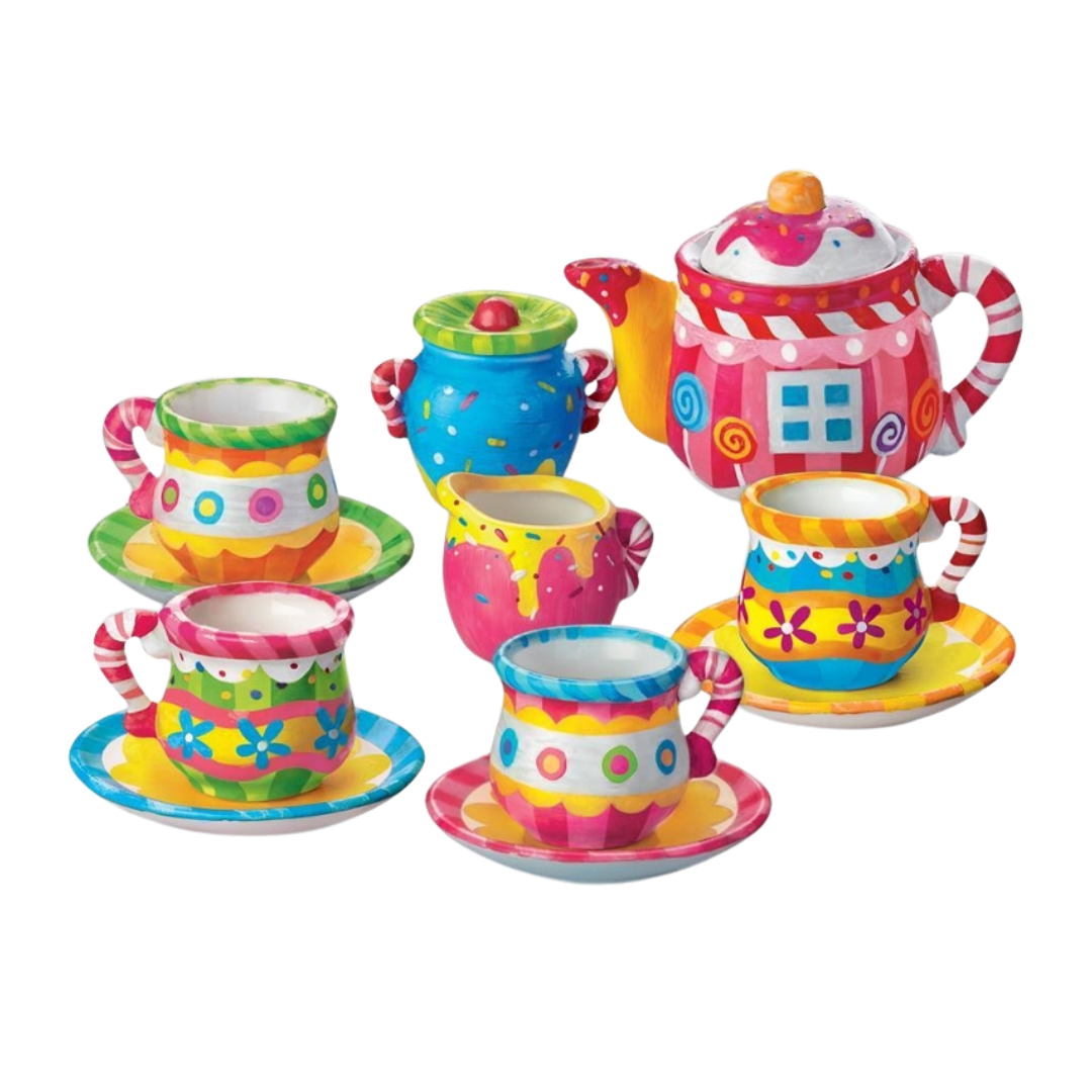 Conjunto colorido de chá com bule e chávenas multicoloridas com padrões florais e de doces