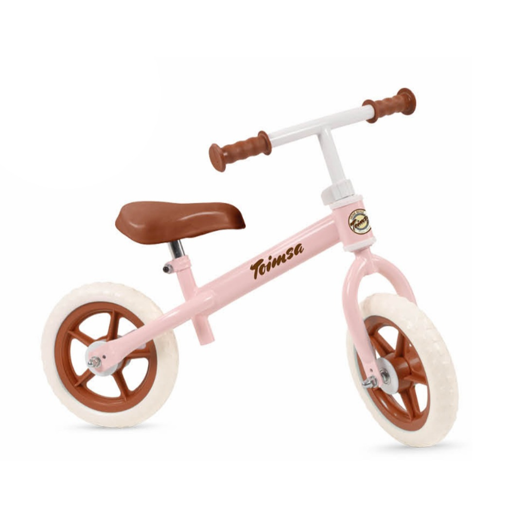 Bicicleta de equilíbrio infantil rosa com detalhes castanhos e pneus brancos