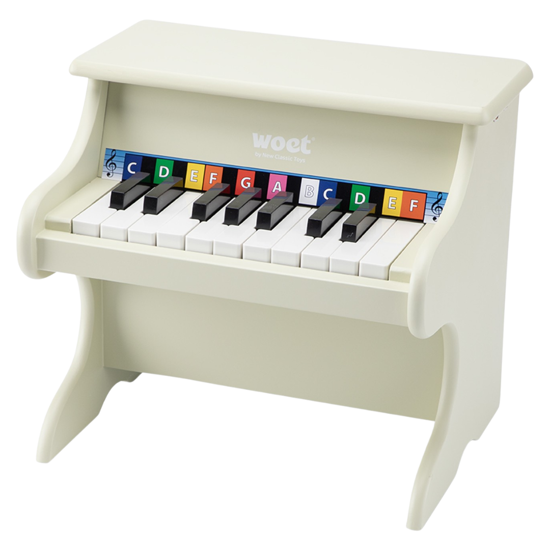 Mini piano elétrico infantil branco creme com teclas coloridas e decoração musical.
