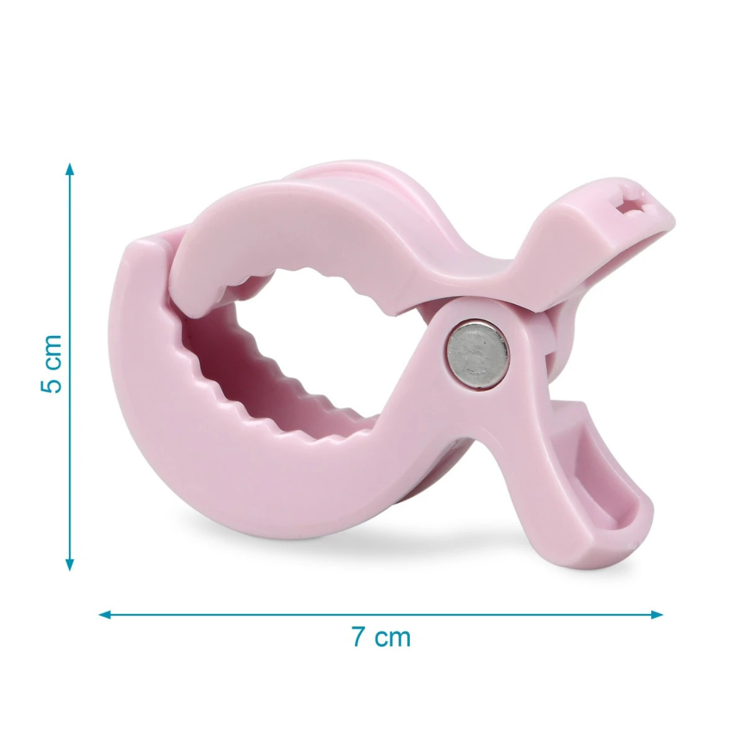 Prendedor de roupa cor de rosa de plástico com mola metálica