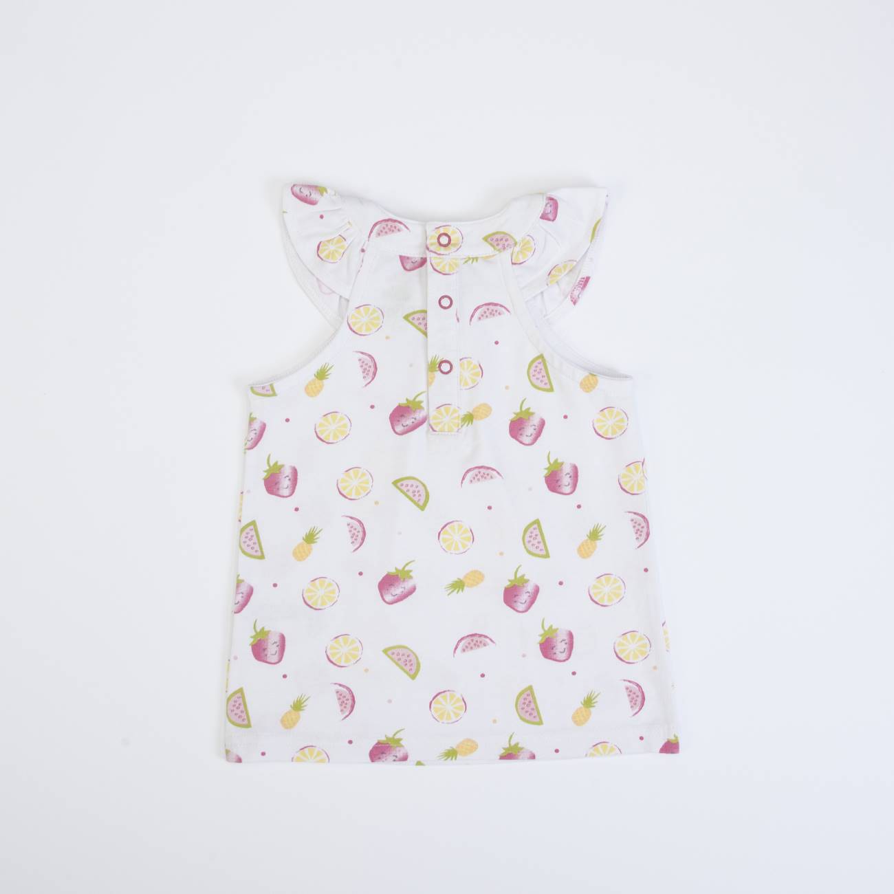 Camisola infantil branca com padrão de frutas e folhos nas mangas, vista de costas