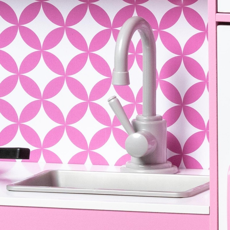 Máquina de cozinha de brinquedo rosa com torneira e pia prateada e fundo geométrico