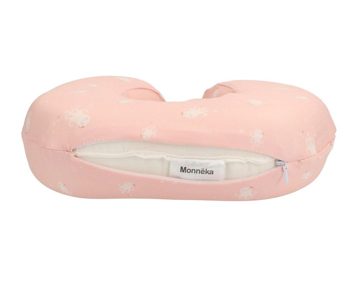 Almofada de apoio rosa claro com padrão branco e fecho