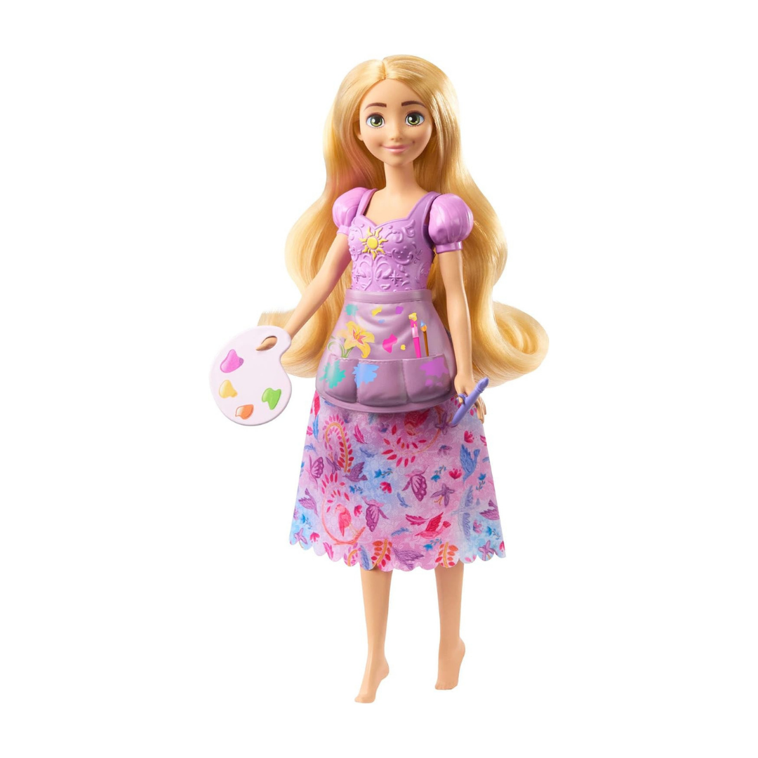 Boneca ruiva com vestido lilás segurando paleta de pintura e pincel
