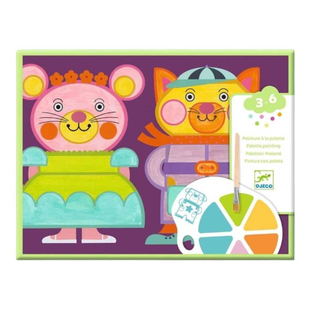 Conjunto de pintura infantil com paleta de cores e pincel sobre caixa colorida com ilustrações de rato e gato.