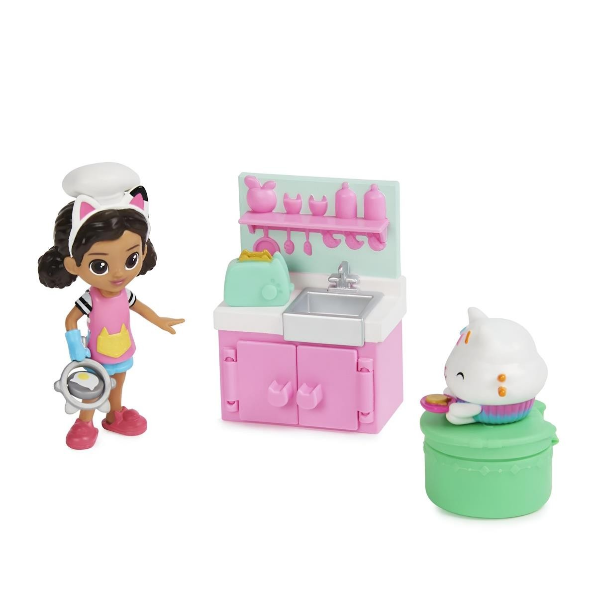 Figura infantil com orelhas de gato, avental, mini forno e bancada rosa e verde, e figura de gato branco com prato colorido