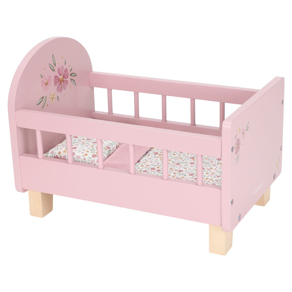 Berço de boneca rosa com decoração de flores e colchão floral