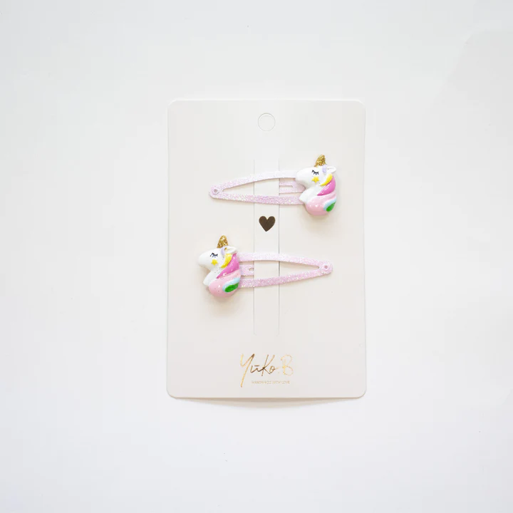 Conjunto de ganchos de cabelo rosa com unicórnios coloridos na embalagem branca