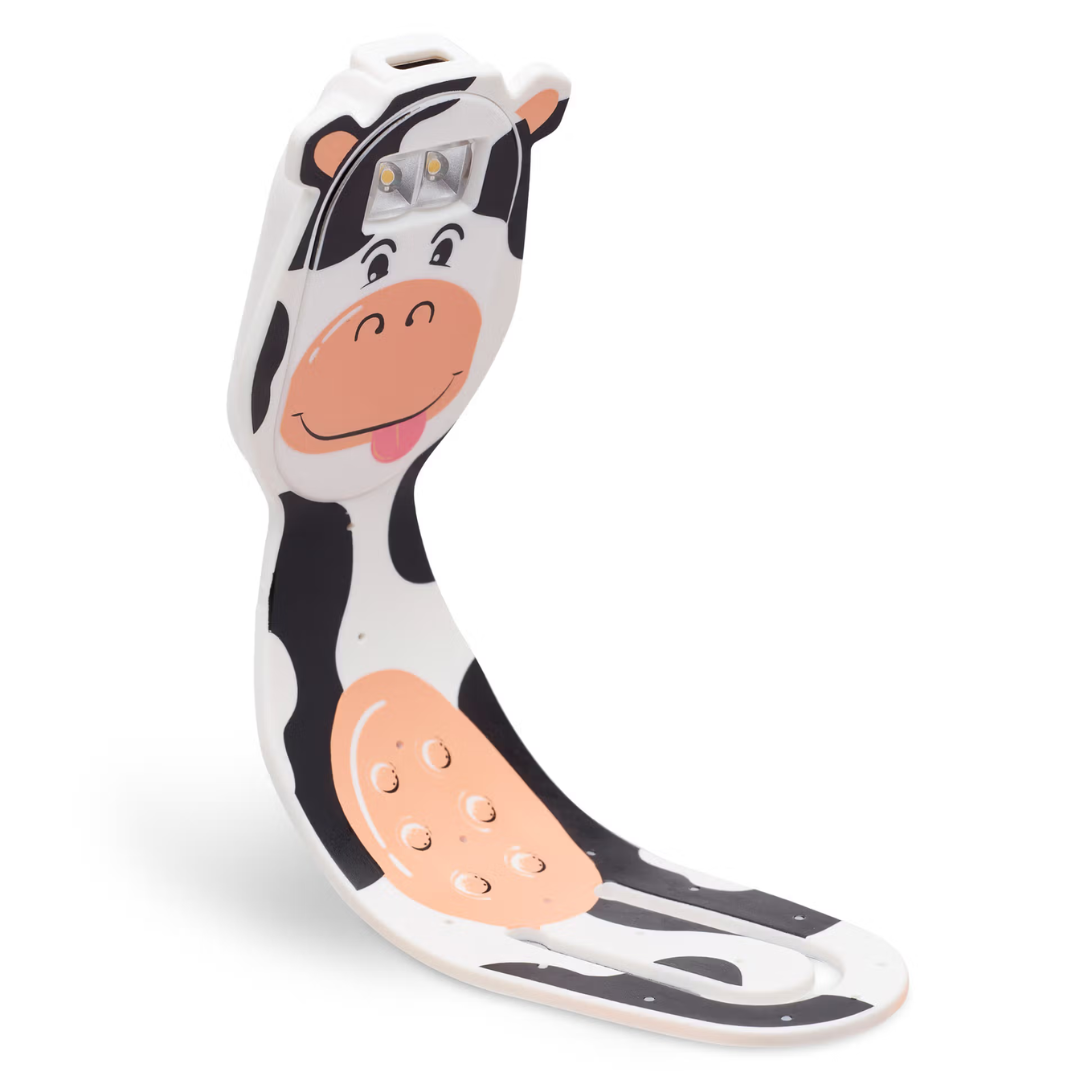 Suporte para telemóvel ou tablet em forma de vaca com padrões pretos, brancos e detalhes laranja.