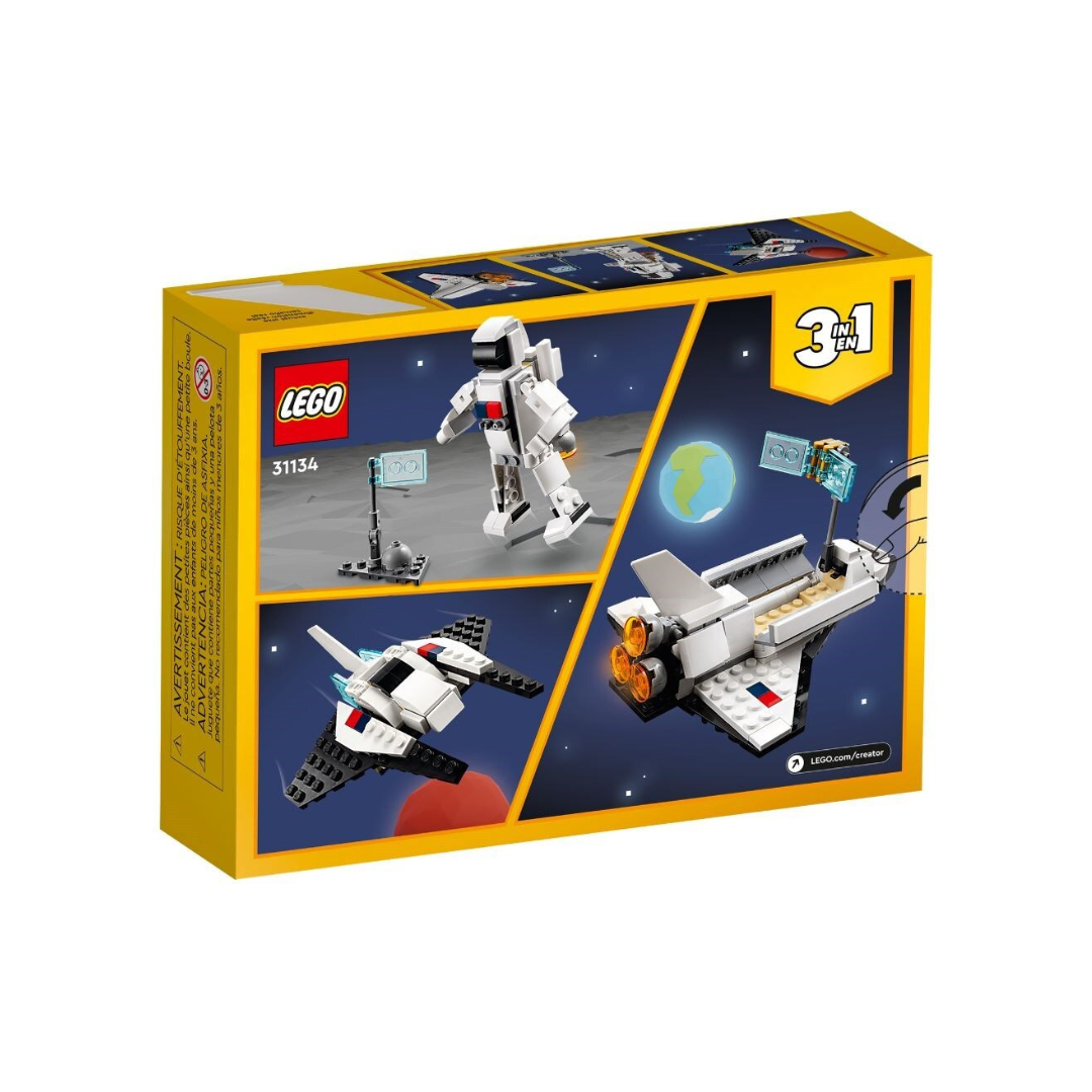 Caixa de brinquedo LEGO 31134 com astronauta e naves espaciais em blocos de construção.