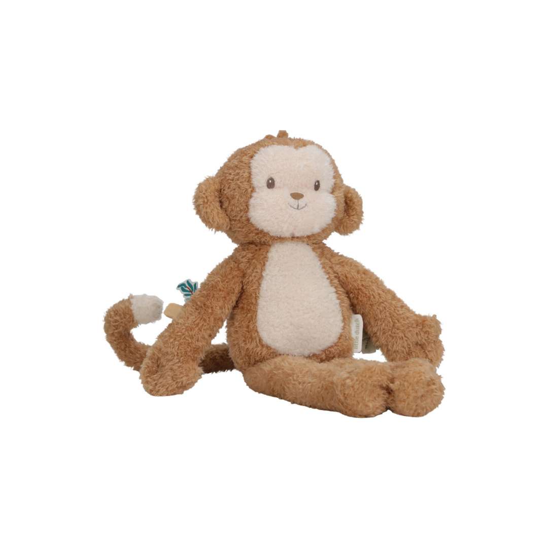 Pelúcia de macaco castanho e creme sentada