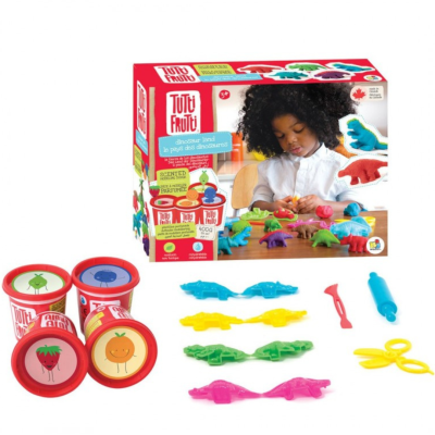 Conjunto de massinha perfumada Tutti Frutti com moldes de dinossauros, ferramentas de modelagem e caixa com imagem de criança a brincar