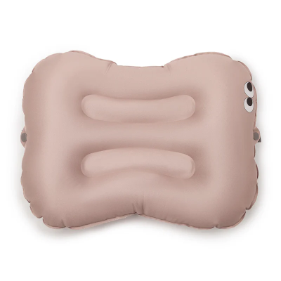 Almofada inflável bege com olhos desenhados