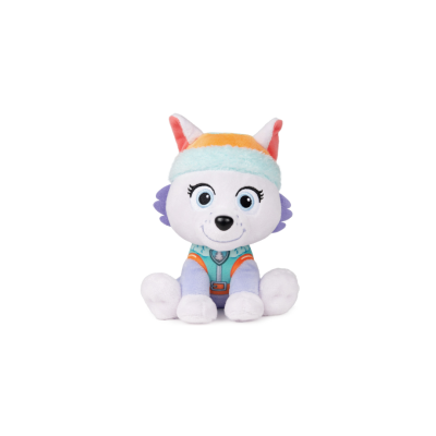Boneco de peluche de animal branco com roupa azul e laranja sentado