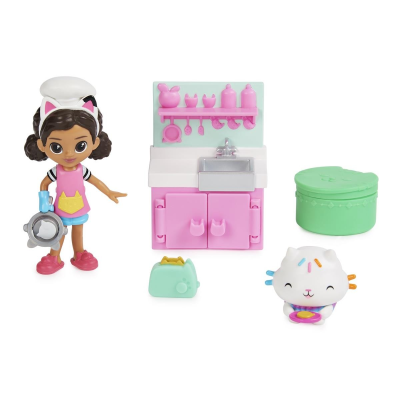 Brinquedo com figura de menina, cozinha rosa, torradeira verde e gato branco colorido