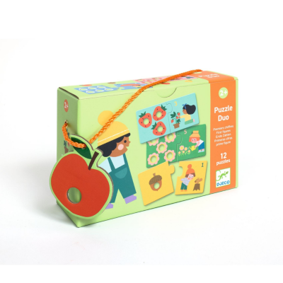 Caixa verde de puzzle Duo com ilustrações infantis e etiqueta em forma de maçã vermelha
