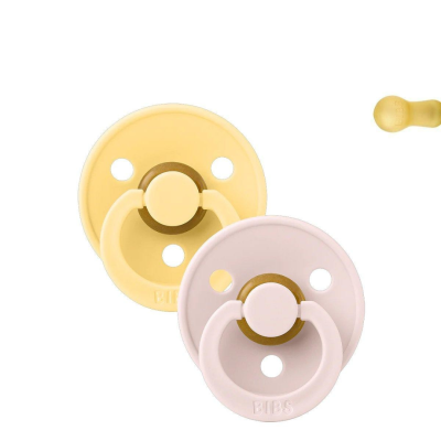 Dois chupetas BIBS amarelo e rosa claro com design redondo e três furos