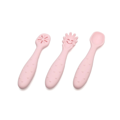 Três colheres pequenas cor de rosa com diferentes formatos na parte de comer