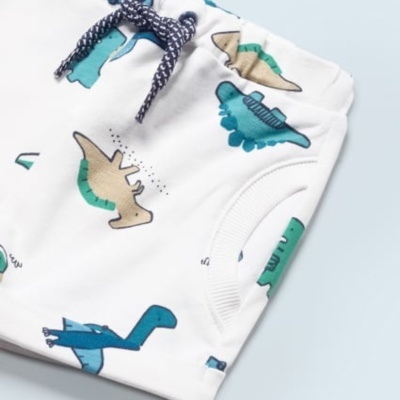 Calças de criança brancas com padrão de dinossauros e cordão azul