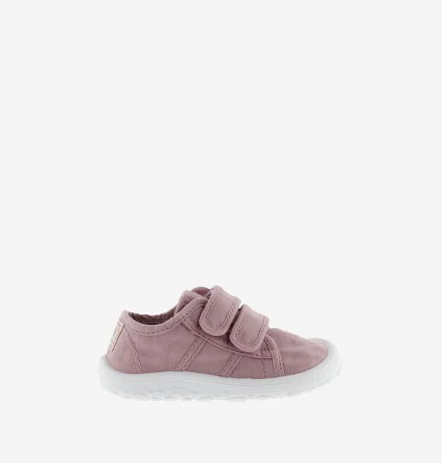 Sapato infantil cor-de-rosa com sola branca e fechos de velcro