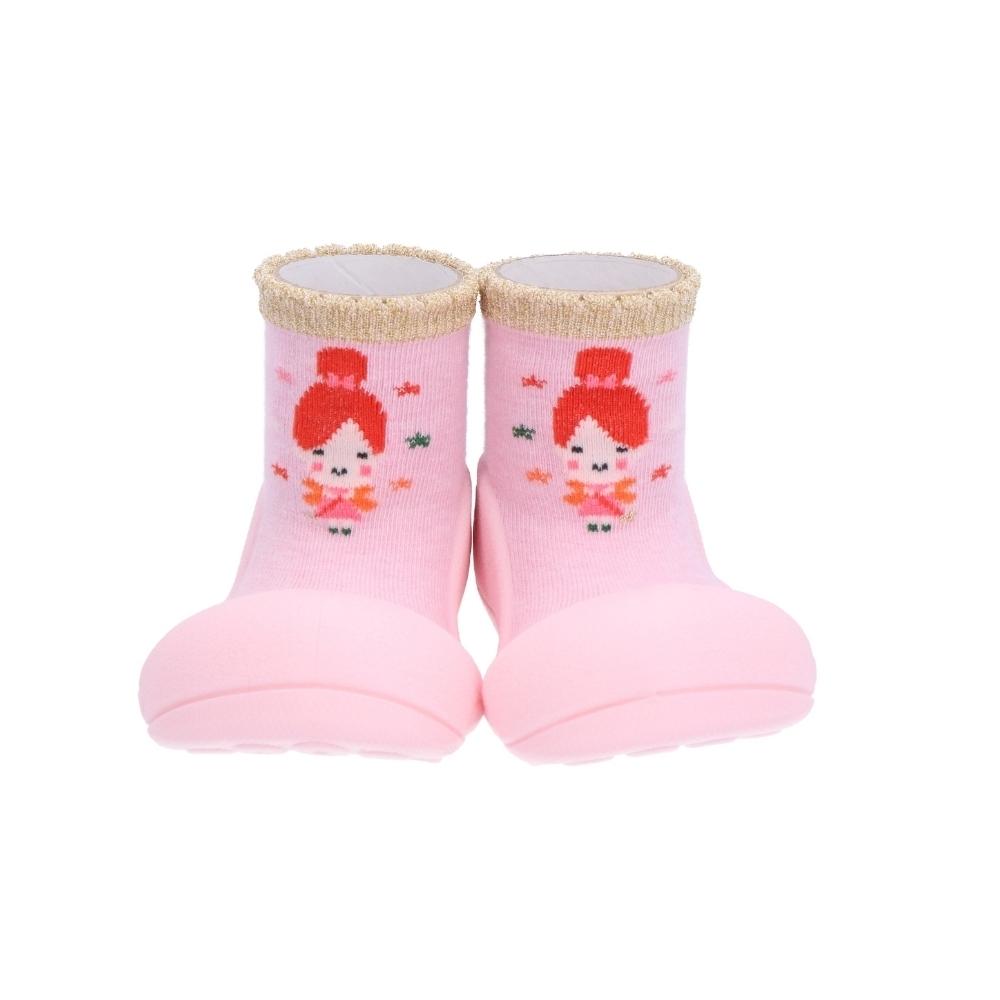 Sapatinhos cor-de-rosa com sola de borracha e padrão de boneca.