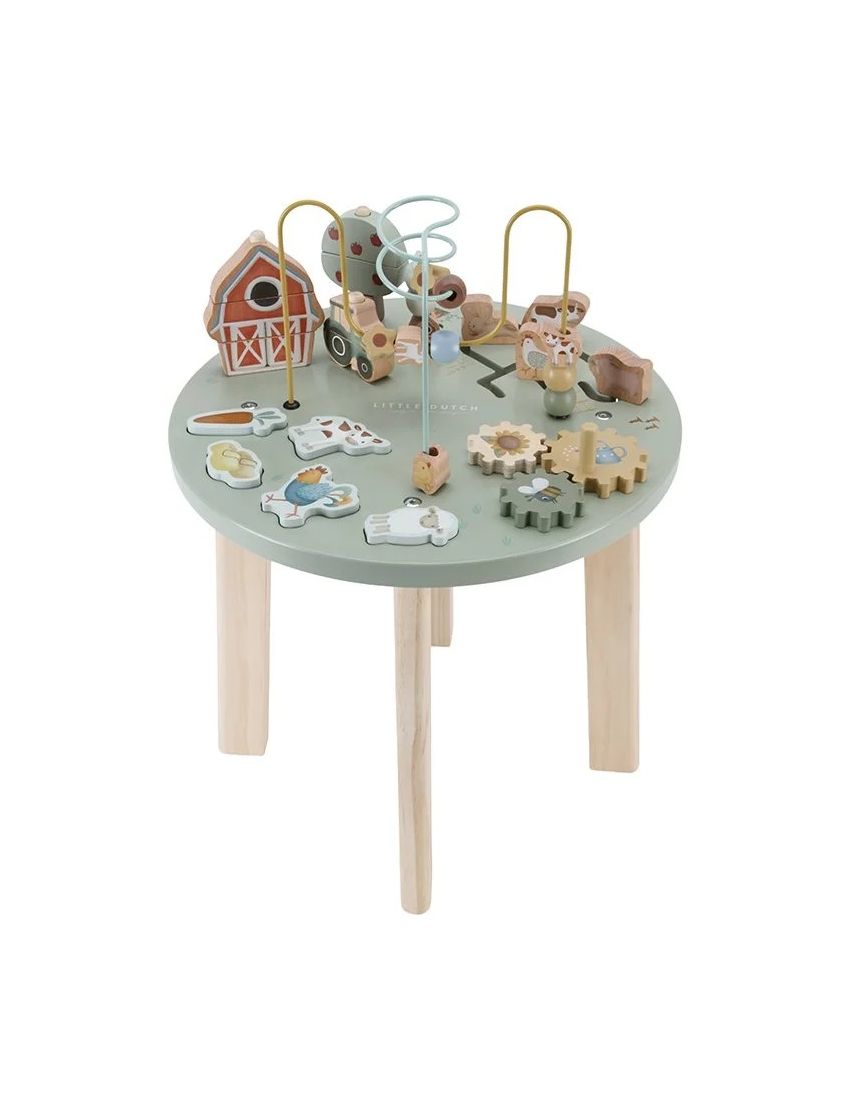Mesa de atividades infantil em madeira com brinquedos de fazenda coloridos no tampo verde