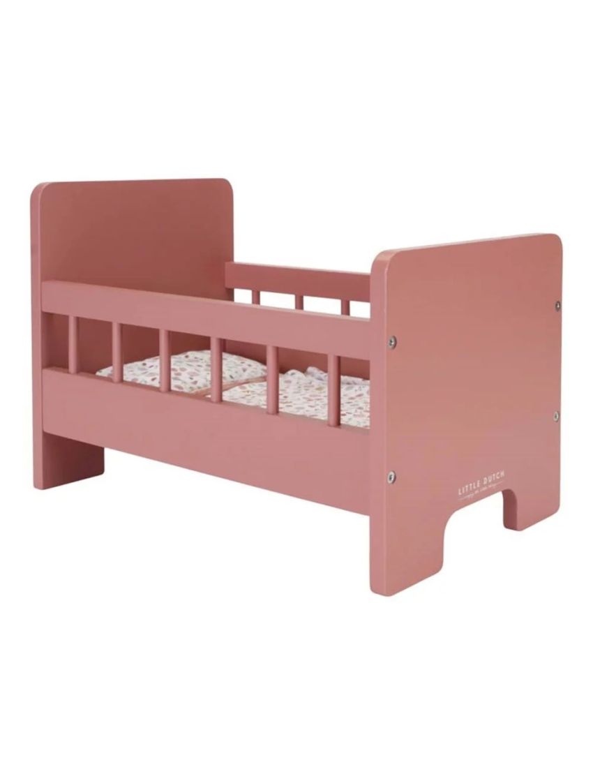 Cama infantil rosa de madeira com laterais ripadas e colchão floral