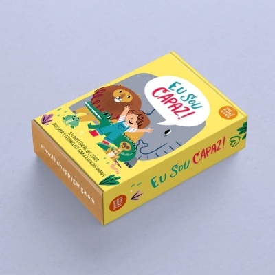 Caixa amarela com ilustrações de animais e criança com o texto Eu Sou CAPAZ!