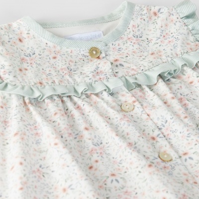 Blusa de bebé floral com botões e folhos verdes