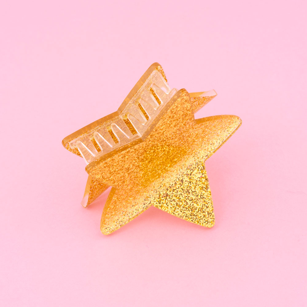 Presa para cabelo estrela dourada com glitter