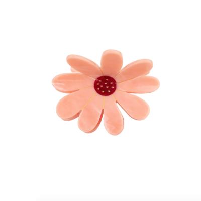 Pregadeira flor cor-de-rosa com centro vermelho e pontos dourados