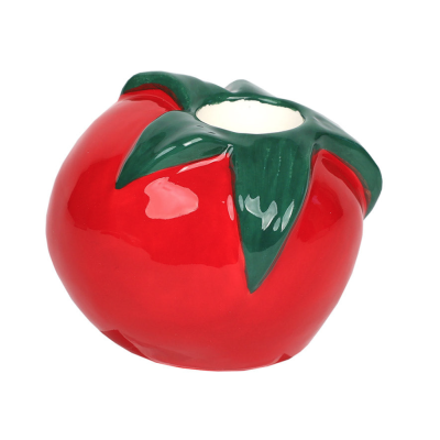 Vela em formato de tomate vermelha e verde com topo aberto