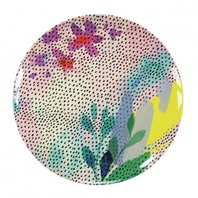 Prato redondo colorido com padrões florais e pontos pretos