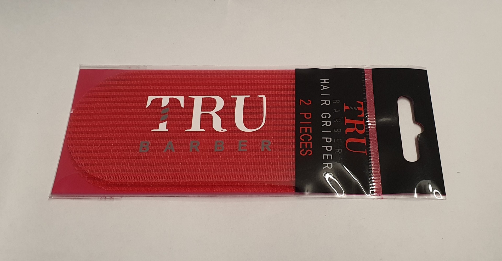 Pack de 2 prendedores de cabelo vermelhos TRU BARBER em embalagem preta e vermelha
