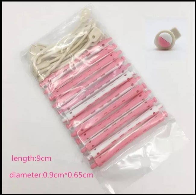 Conjunto de varas de plástico rosa com pinos brancos em saco plástico transparente