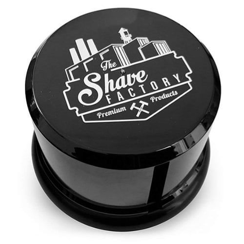Pote preto redondo com tampa com o logotipo da The Shave Factory em branco