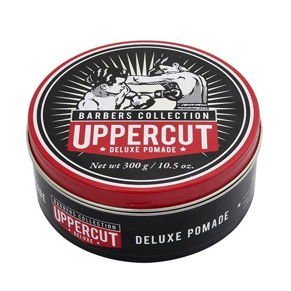 Lata de pomada para cabelo Uppercut Deluxe Pomade preta e vermelha com ilustração de luta
