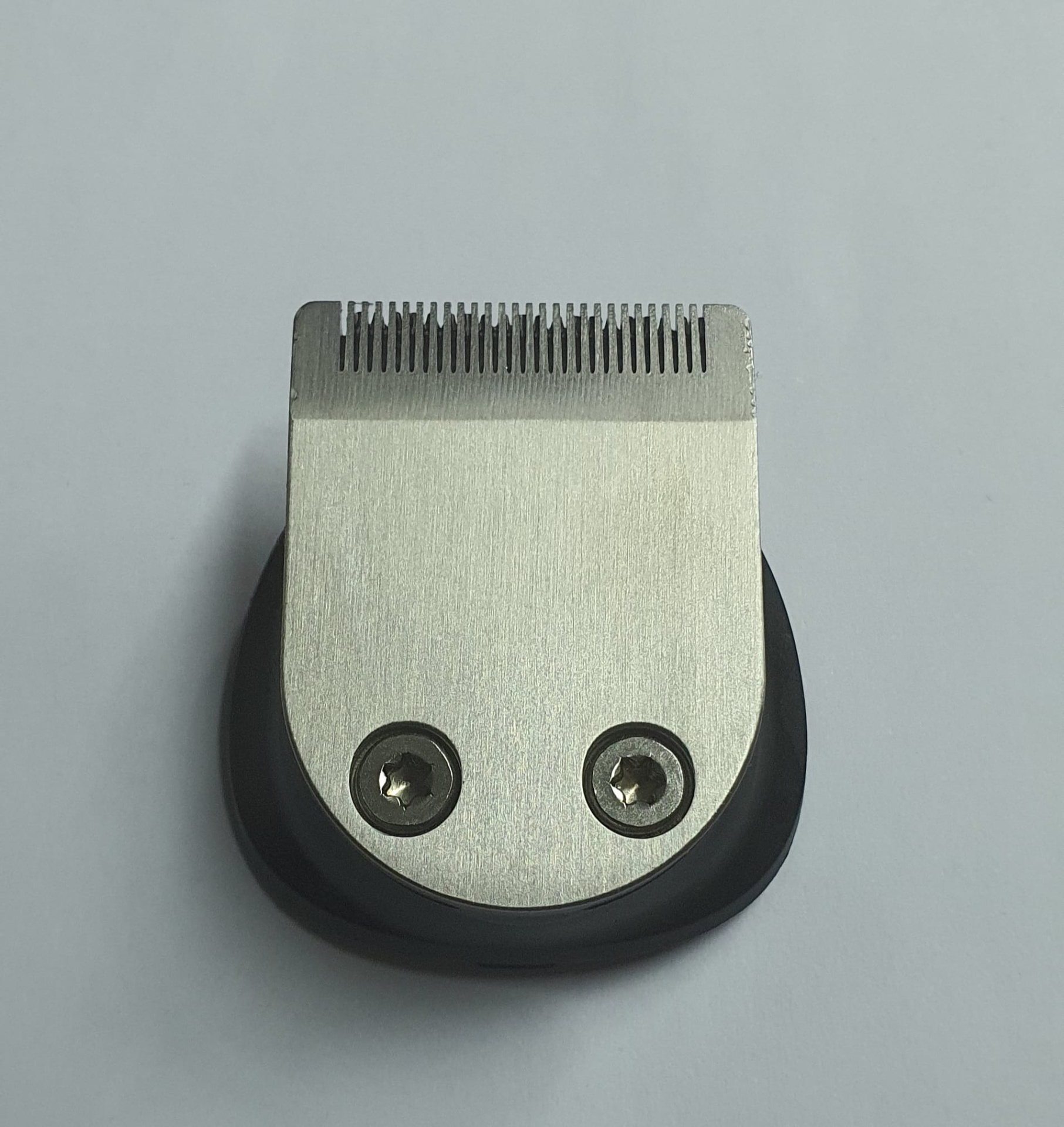 Cabeça de máquina de cortar cabelo metálica e preta