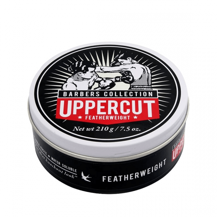 Pote preto com tampa de metal do produto Uppercut Featherweight com ilustração de boxeadores
