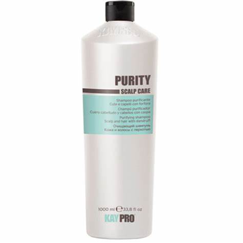 Frasco branco de champô PURITY SCALP CARE com tampa preta e texto em castanho e verde-água