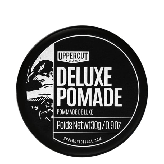 Embalagem preta redonda de pomada capilar Uppercut Deluxe com texto branco e negro