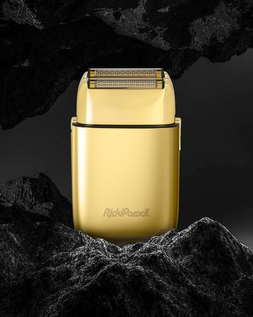 Aparelho de barbear elétrico dourado com grelha metálica