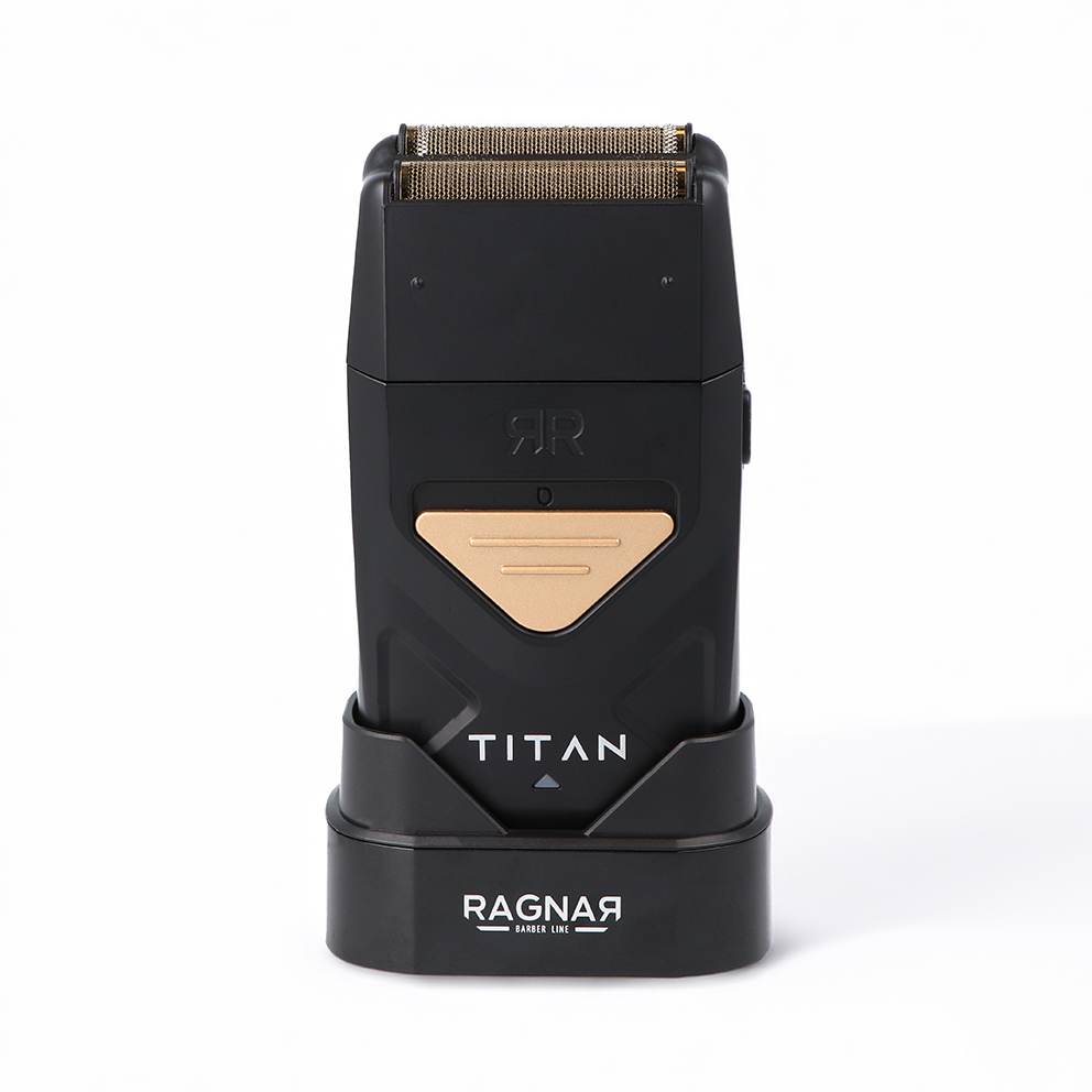 Aparelho de barbear elétrico preto com detalhes dourados na base